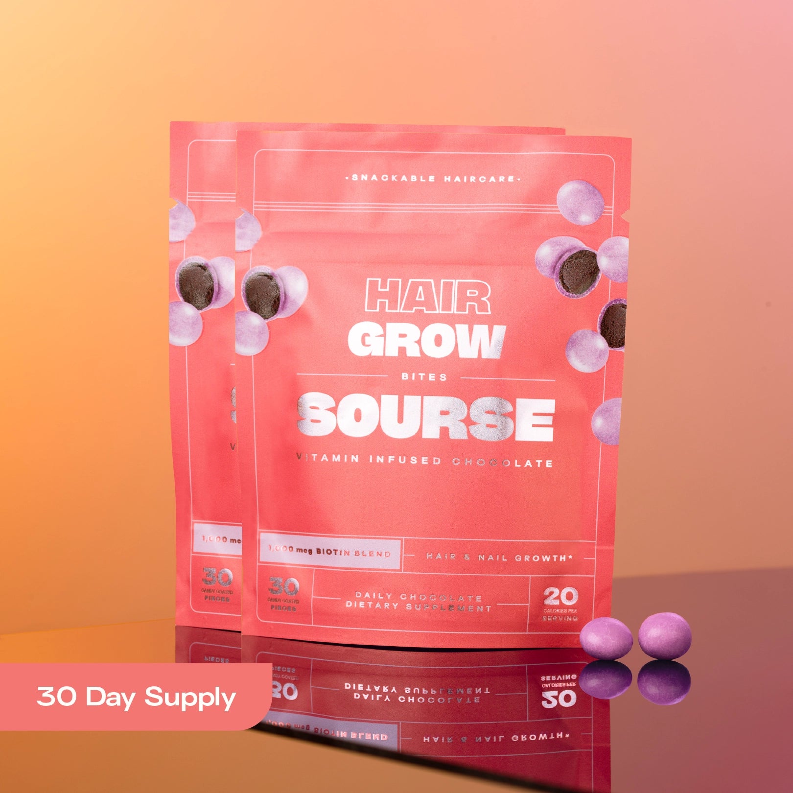 Two bags of Sourse Hair Grow vitamin-infused chocolate bites with purple candies.