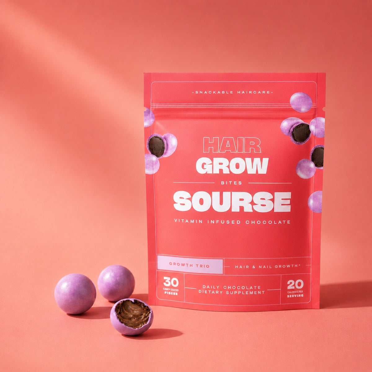 Hair Grow Bites pouch with chocolate bites, one broken open